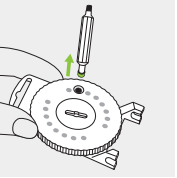 A hand holding a screwdriver  Description automatically generated